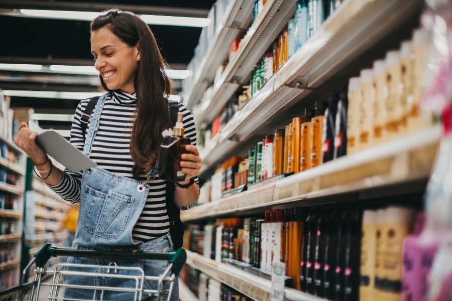 Woman looking at grocery shopping list